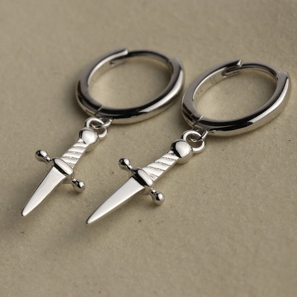 Mini daggers hoop earrings in sterling silver with a snap close.